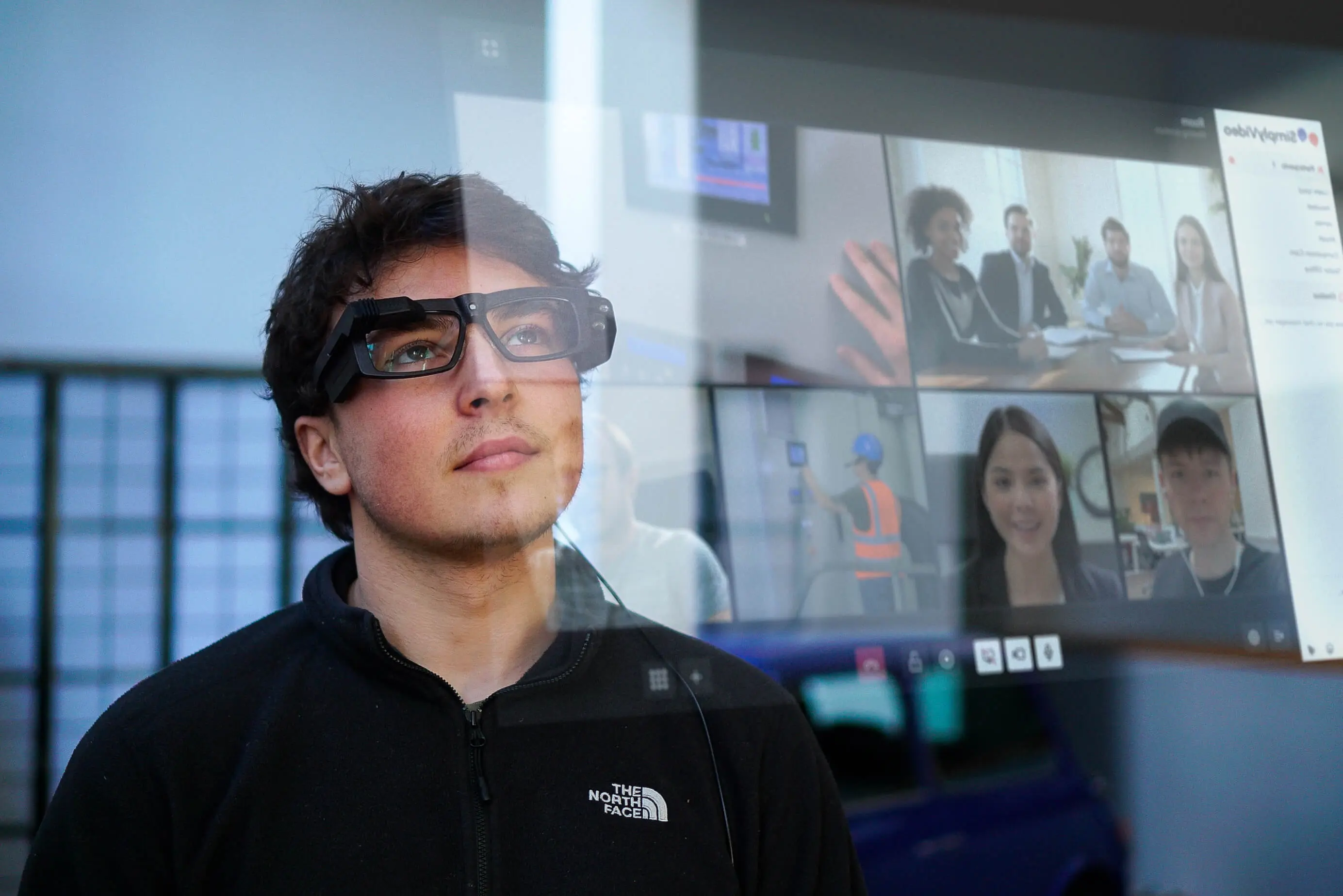 Person looking at screen with wearables