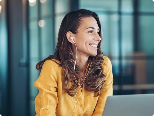 woman wearing headphones smiling