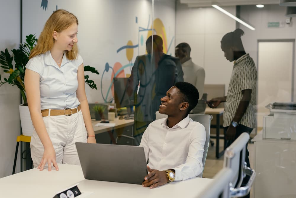 Coworkers talking in an office