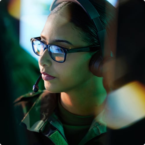 Military woman on video call in military control room