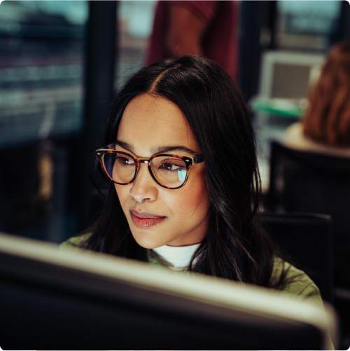 Mixed_race_woman_working_typing_sitting_in_office_block