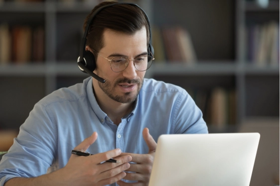 man on video call wearing headphones and microphone