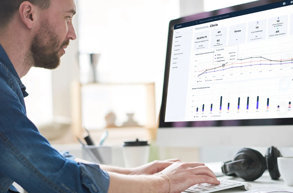 man using cloud video interop technology to look at a dashboard