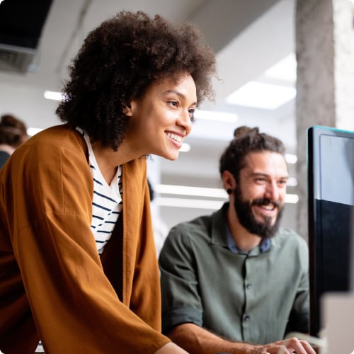 Managers_smiling_looking_at_monitor