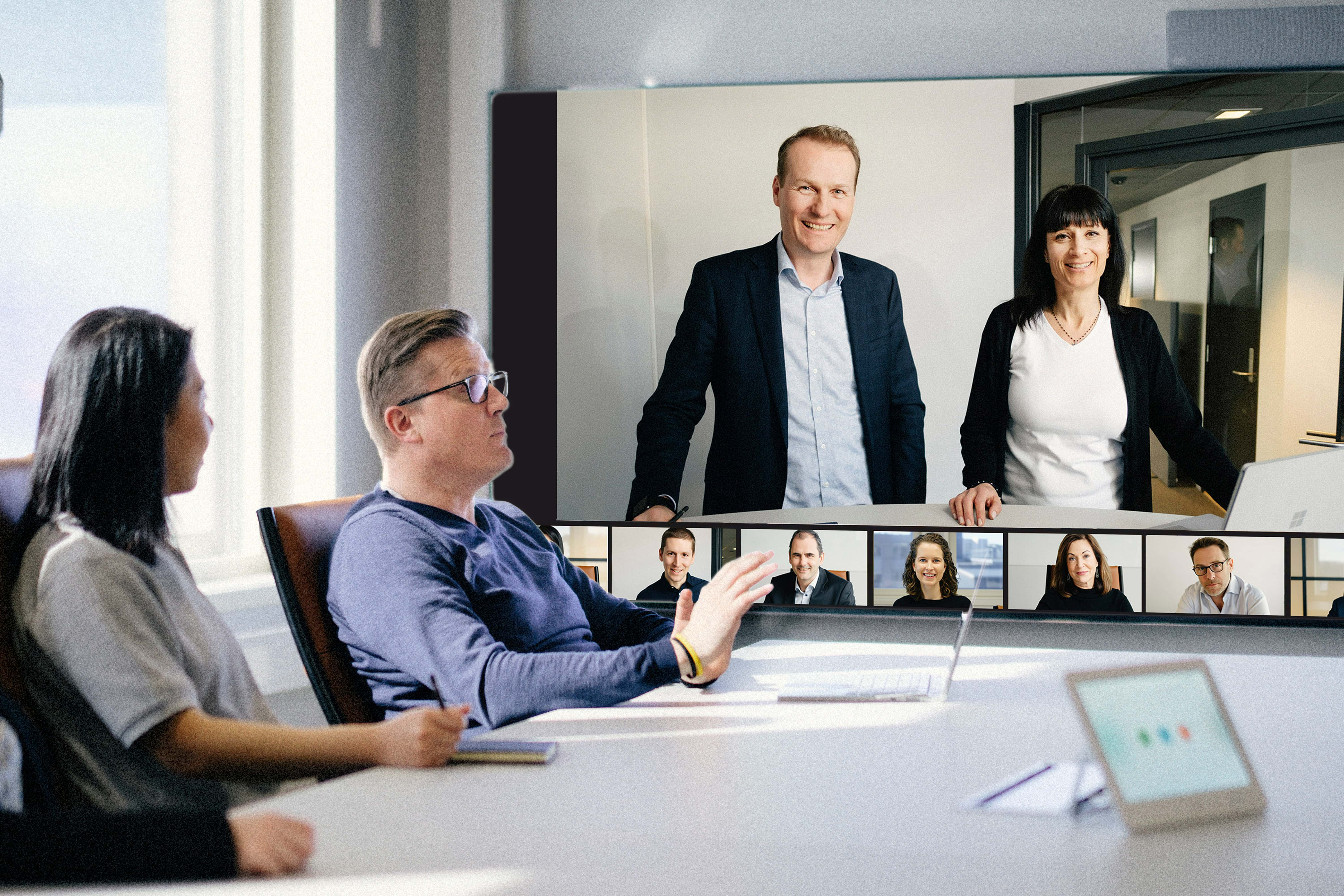 Video meeting in progress on large screen display